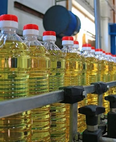 Sunflower oil in the bottle moving on production line
