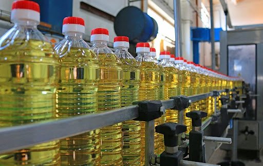 Sunflower oil in the bottle moving on production line Sunflower oil in the bottle moving on production line